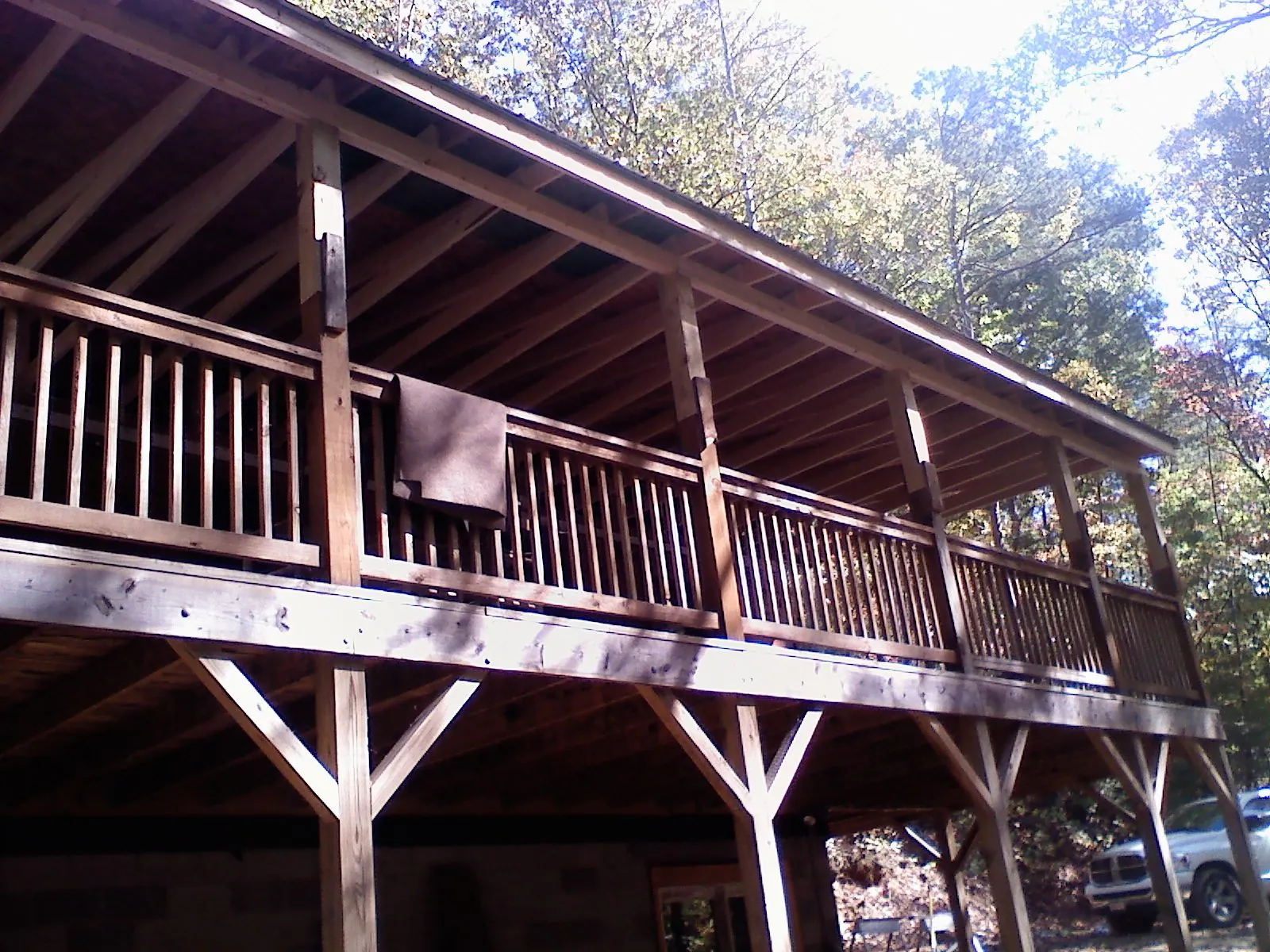 Timber framing under a new elevated porch and deck — Roof Leak Repair in Canfield by Roofing Brothers